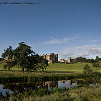 Buy canvas prints of Alnwick Castle reflected in the River Aln by Jim Jones