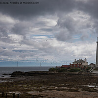 Buy canvas prints of St Mary's Island under a stormy sky by Jim Jones