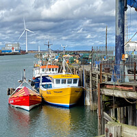 Buy canvas prints of Colourful Fishing Boats by Jim Jones