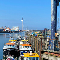 Buy canvas prints of Colourful fishing boats by Jim Jones