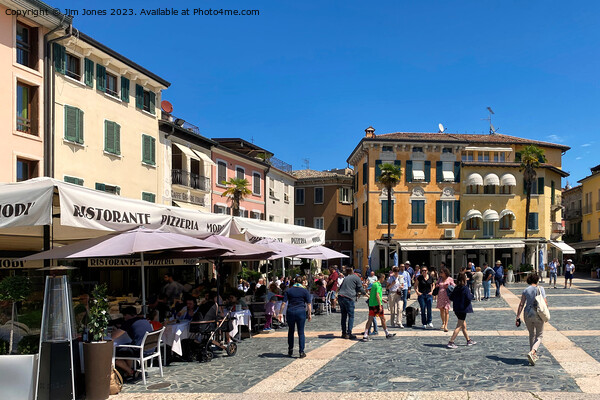 Time for a coffee in Sirmione Picture Board by Jim Jones