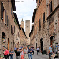 Buy canvas prints of Window Shopping in San Gimignano by Jim Jones