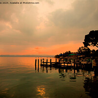 Buy canvas prints of Super Silhouetted Sirmione Sunset by Jim Jones