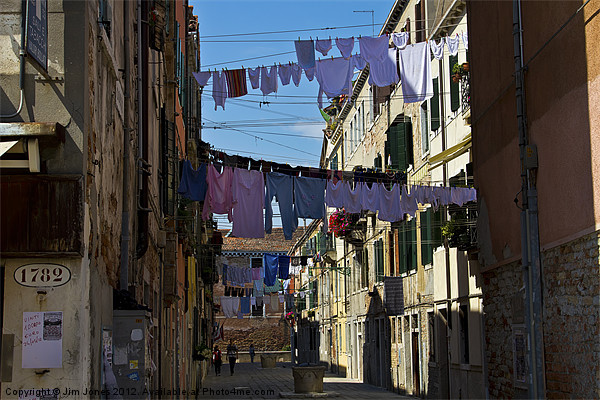 Venetian street on washing day Picture Board by Jim Jones