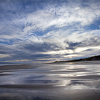 Buy canvas prints of Cloudy blue sky reflected in the wet sand at Druri by Jim Jones