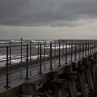 Buy canvas prints of The Old Wooden Pier on a stormy morning by Jim Jones