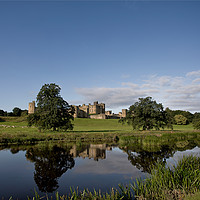 Buy canvas prints of Alnwick Castle reflected in the River Aln by Jim Jones