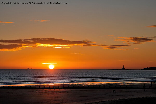 Sunrise over a tranquil North Sea Picture Board by Jim Jones