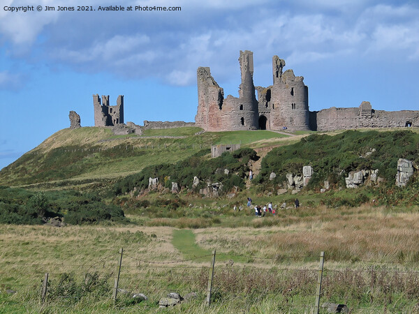 Majestic Ruins of Dunstanburgh Castle in Northumbe Picture Board by Jim Jones