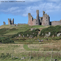 Buy canvas prints of Majestic Ruins of Dunstanburgh Castle in Northumbe by Jim Jones