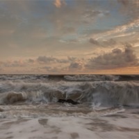 Buy canvas prints of Sunset and waves by Ian Jones