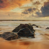 Buy canvas prints of Sunset over the rocks by Ian Jones