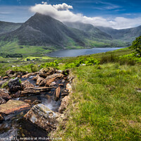 Buy canvas prints of Tryfan Mountain And Llyn Ogwen Wales by Adrian Evans