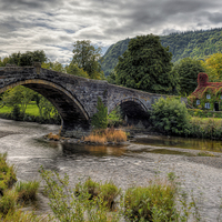 Buy canvas prints of Pont Fawr Bridge 1636 by Adrian Evans