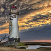 Buy canvas prints of Sunset Lighthouse by Adrian Evans
