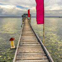 Buy canvas prints of Pier Flags by Adrian Evans