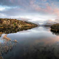 Buy canvas prints of Padarn lake Llanberis Sunset by Adrian Evans