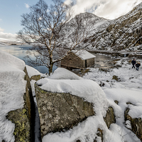Buy canvas prints of Frozen Ogwen Lake Snowdonia by Adrian Evans
