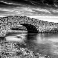 Buy canvas prints of Aberffraw Bridge Anglesey by Adrian Evans