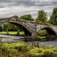 Buy canvas prints of Llanrwst Bridge and Cottage Wales  by Adrian Evans
