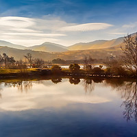 Buy canvas prints of Winter Reflections Padarn lake Llanberis  by Adrian Evans