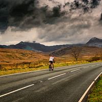Buy canvas prints of Cyclist Snowdonia Winter  by Adrian Evans
