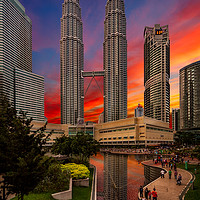 Buy canvas prints of Petronas Towers Sunset Kuala Lumpur by Adrian Evans