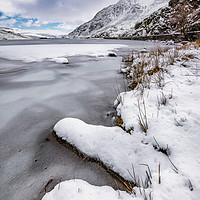 Buy canvas prints of Snowfall at Ogwen Lake Snowdonia by Adrian Evans