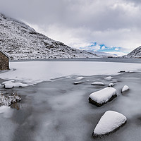 Buy canvas prints of Frozen Ogwen Lake Snowdonia by Adrian Evans
