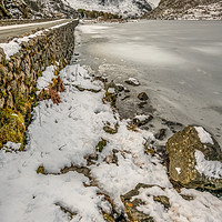 Buy canvas prints of Icy Ogwen Lake Snowdonia by Adrian Evans