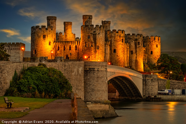 Lights On Conwy Castle Canvas Print by Adrian Evans