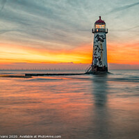Buy canvas prints of Talacre Lighthouse Sunset Wales by Adrian Evans