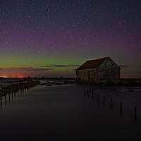 Buy canvas prints of The Northern lights over the old coal barn at Thornham  by Gary Pearson
