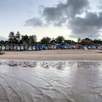Buy canvas prints of A beach hut panorama - Wells-next-the-Sea by Gary Pearson