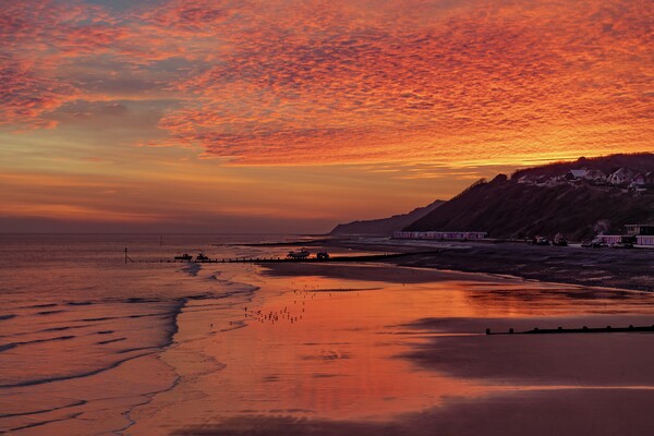 Sunrise over Cromer beach Picture Board by Gary Pearson