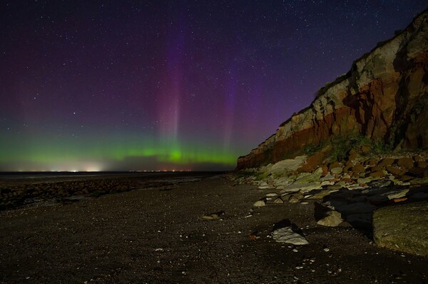 The Northern lights dancing over Hunstanton beach  Picture Board by Gary Pearson