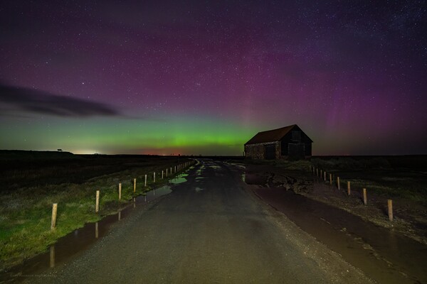 Northern lights over the old coal barn at Thornham  Picture Board by Gary Pearson