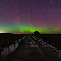 Buy canvas prints of Northern lights dancing over the old coal barn at Thornham  by Gary Pearson