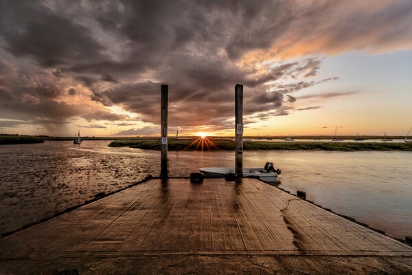 A moody sunset at Brancaster Staithe  Picture Board by Gary Pearson