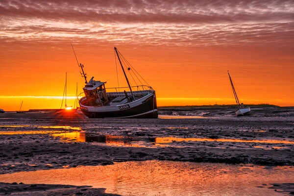 Sunrise over Brancaster Staithe  Picture Board by Gary Pearson