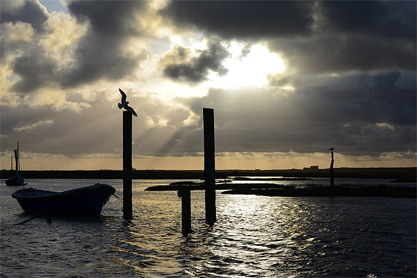 Brancaster Staithe God ray silhouette Picture Board by Gary Pearson