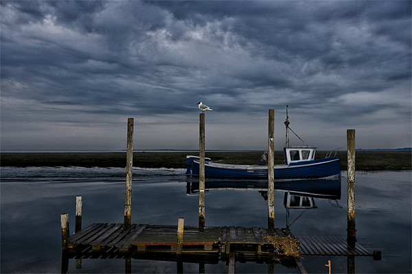 Moody sky over Thornham staithe Picture Board by Gary Pearson