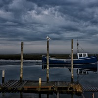 Buy canvas prints of Moody sky over Thornham staithe by Gary Pearson