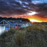 Buy canvas prints of Hunstanton beach huts sunset scene by Gary Pearson