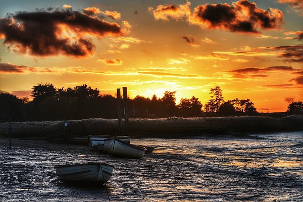 Brancaster Staithe low tide sunset Picture Board by Gary Pearson