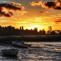 Buy canvas prints of Brancaster Staithe low tide sunset by Gary Pearson