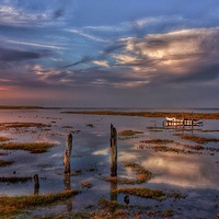 Buy canvas prints of Thornham marsh sunset reflections by Gary Pearson