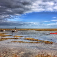 Buy canvas prints of The red rowing boat Thornham by Gary Pearson
