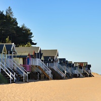 Buy canvas prints of Colourful beach huts at Wells by Gary Pearson