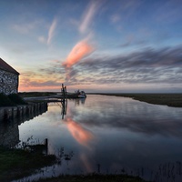 Buy canvas prints of Reflections of sunset Thornham harbour by Gary Pearson